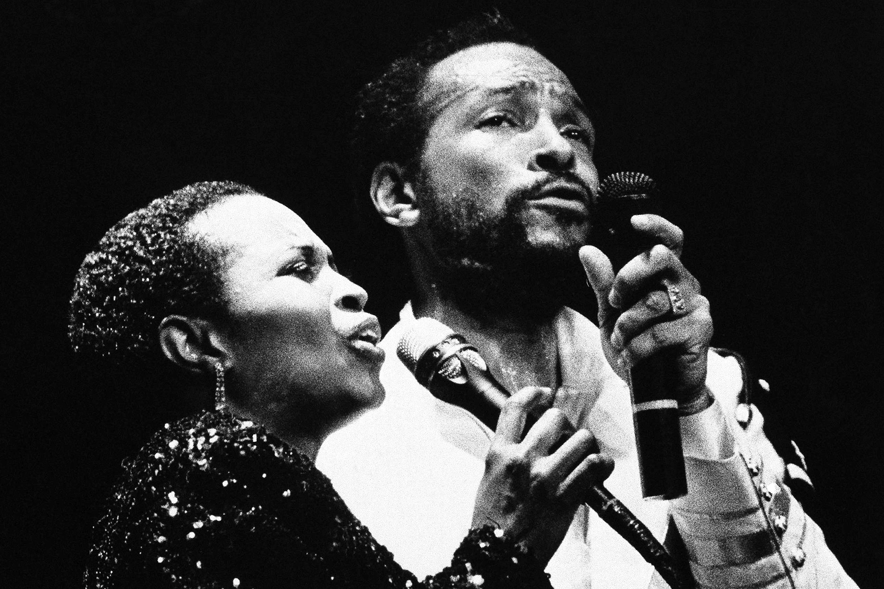 Marvin Gaye, right, with back up singer Paulette McWilliams at Radio City Music Hall, Tuesday, May 18, 1983, New York. Gaye opened a five day concert series. (AP Photo/Nancy Kaye)